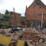 Landowner fined after builder was seriously injured in wall collapse